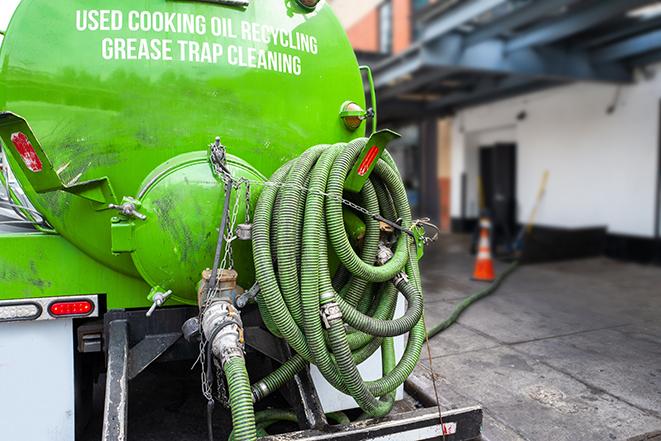 a service truck pumping grease from a restaurant's grease trap in Broad Run, VA